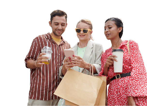Smiling friends posting content on social media after shopping together on seasonal sale
