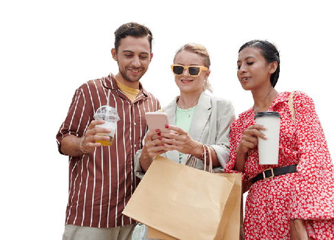 Smiling friends posting content on social media after shopping together on seasonal sale