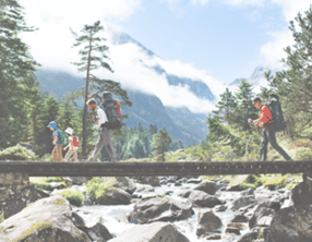 Fathers and children hiking together in mountains