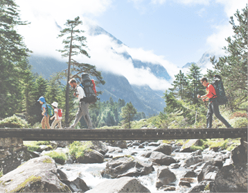 Fathers and children hiking together in mountains